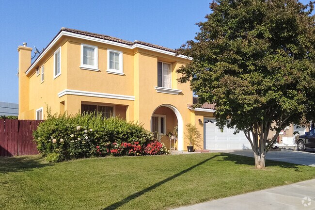 A colorful yellow Spanish home brightens the streets of South Pointe.
