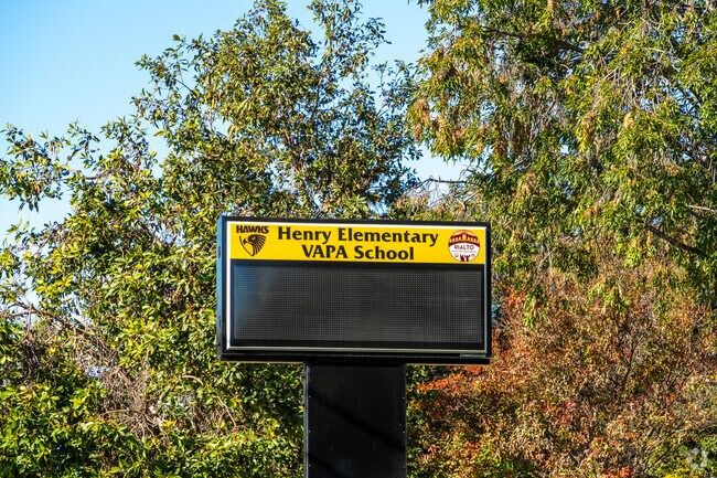 The signage of Henry Elementary School offers essential information and a warm welcome.