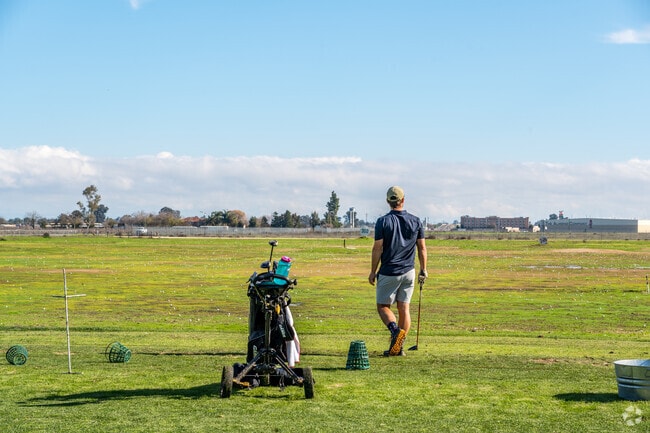 Golfers can practice on the driving range at Madera Municipal Golf Course.