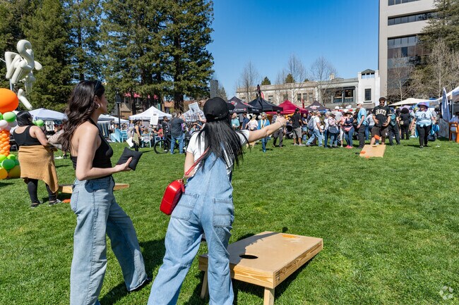 The SOCO Market near Proctor Terrace offers activities on the lawn like cornhole games.