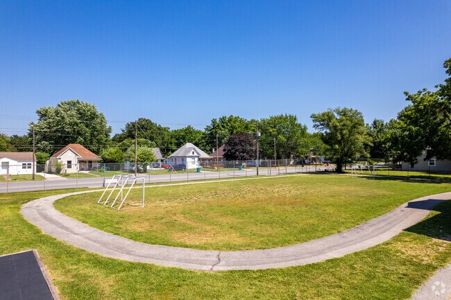 The Bowerman Elementary School playground features a paved walking track and small sports field.