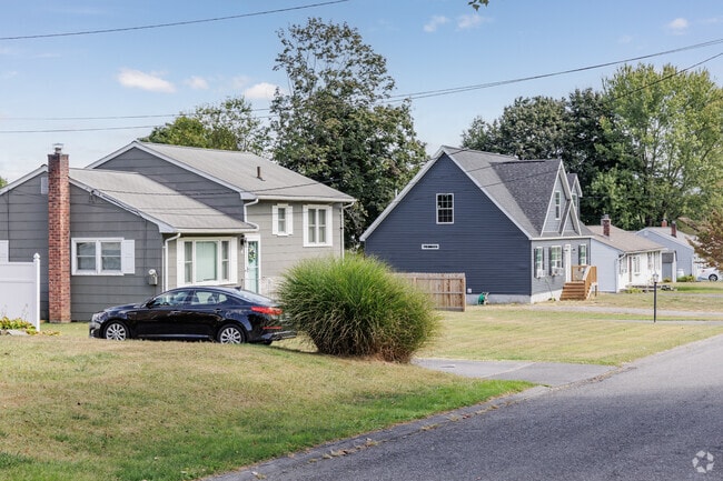 A variety of house styles share a street in Ruby, NY.