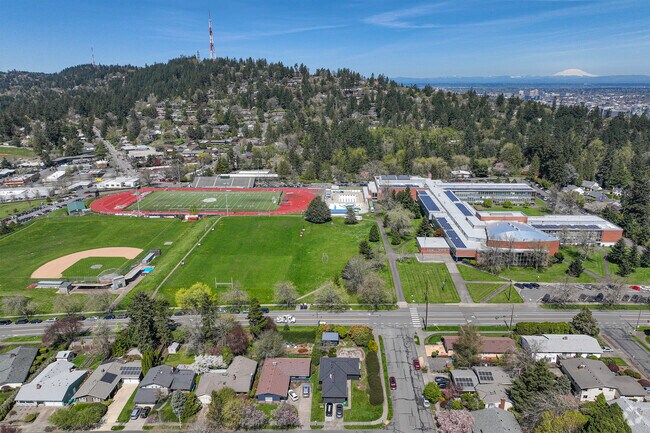 Aerial view of Ida B. Wells-Barnett High School central to Hillsdale, Portland.