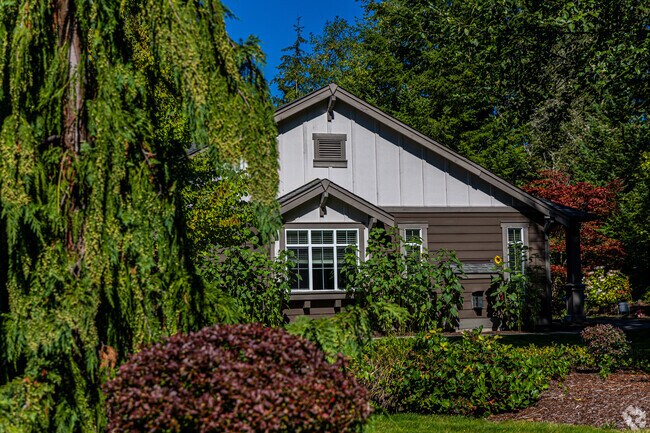 A lush garden hides a beautiful rancher home in the McCormick Woods neighborhood.