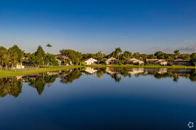 Waterfront homes in Country Isles reflect on the water.