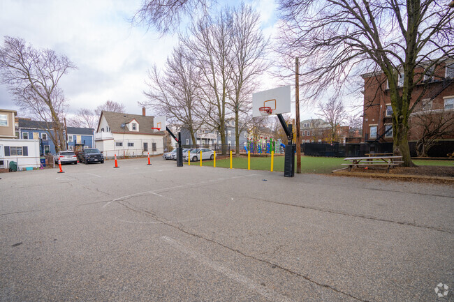 There are two basketball hoops in the Prospect Hill Academy schoolyard in East Somerville.
