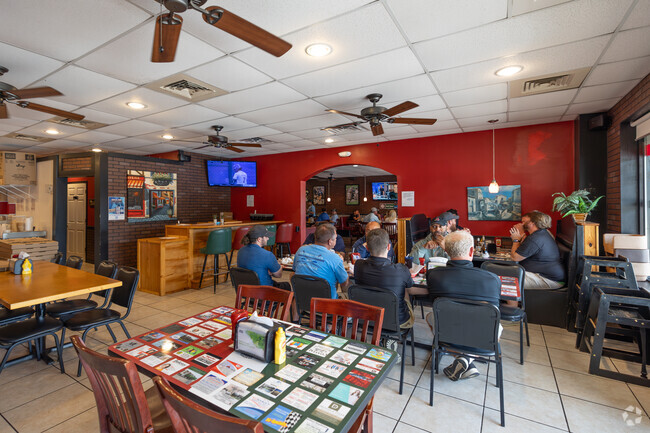 Camelia residents meet up at Semmes House of Pizza for delicious pizza, calzones, or wings.