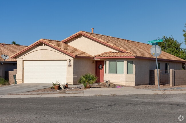 Mesquite Ranch homes showcase varied entry designs within the Spanish Revival style.