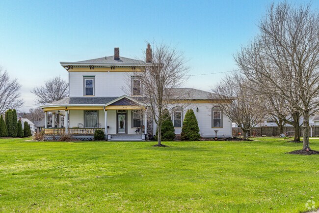 A sprawling Victorian estate on a large lot stands proudly, in Minerva.