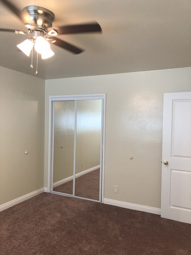 Master bedroom is newly carpeted with large closet and mirrored doors.