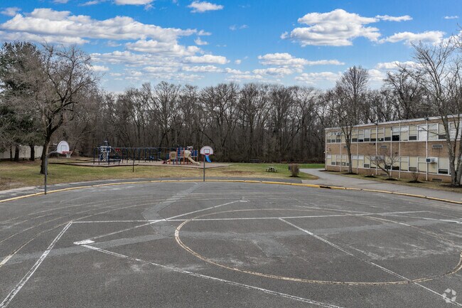 M. Scott Carpenter Elementary School's basketball court and playground.