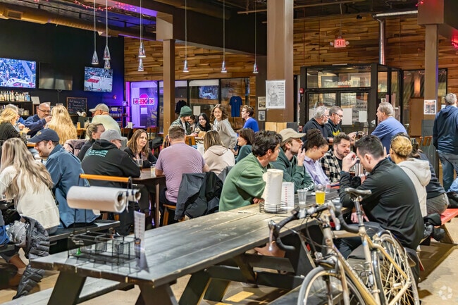 Friends gather for a long fun night at Buzz Worthy Trivia at Helltown Brewery.