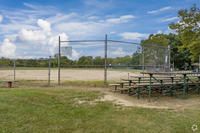 Watch a baseball game at Greg Angeletti Field just outside Rolling Acres neighborhood.