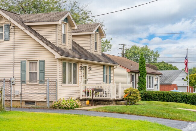 Cottages and Cape Cods display vernacular architecture and sizable lawns in South Lebanon.