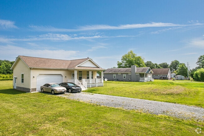 Ranch-style homes are common in Temperanceville, offering one-story living and generous acreage in a peaceful setting.