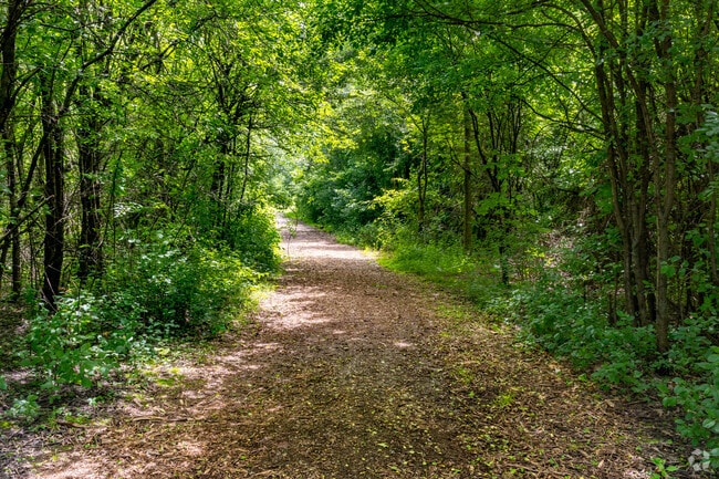 Manhattan Park offers wooded walking trails for visitors.