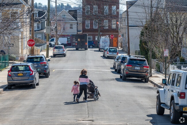 A family walks back from the park in Sleepy Hollow Village.