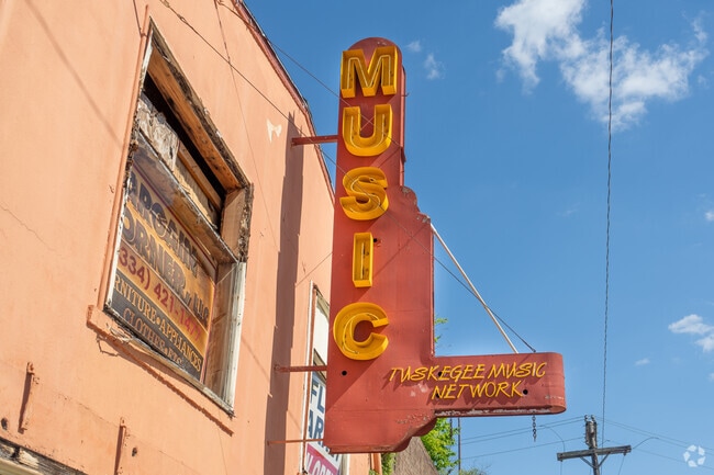 The Tuskegee Music Network sign gives a nostalgic vibe to the downtown area.