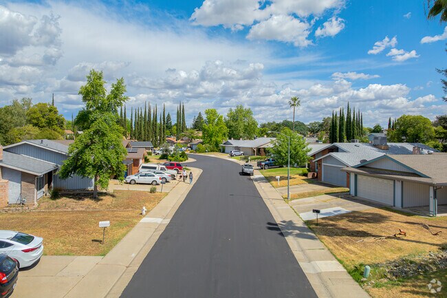 Long-time Sun River residents walk their dog along the wide residential streets.