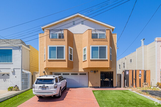 Find character homes like this stucco 2-story home in the Bayshore neighborhood.
