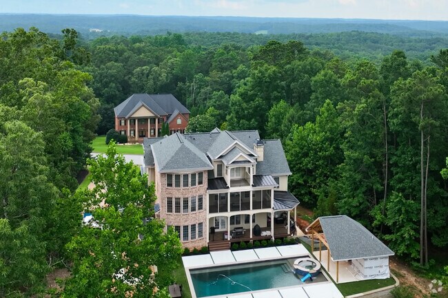 Hidden in the tall trees of Bill Arp, are large, premium custom-built estates.