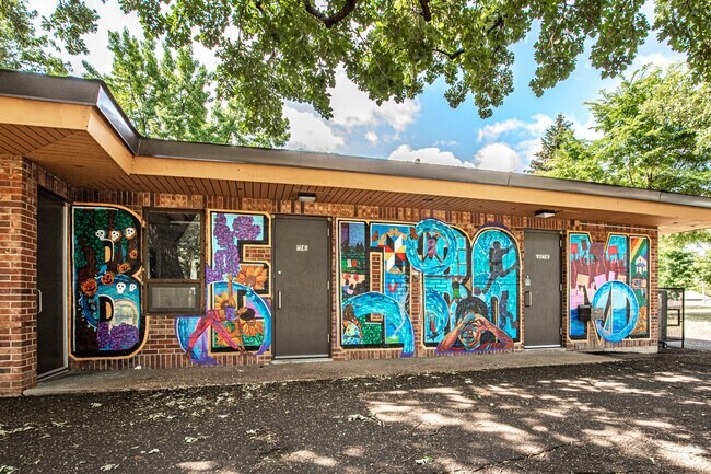 A colorful mural decorates the wall of the Beltrami Park building.