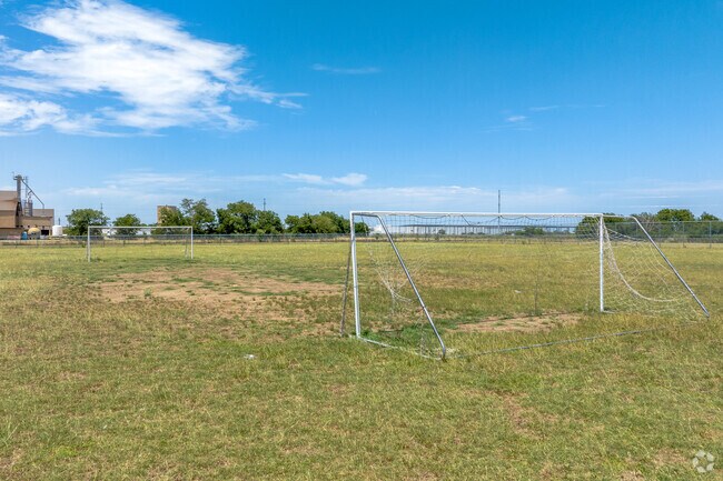 Soccer fields at Cesar Chavez Primary School host pick up games for students from Fort Worth.