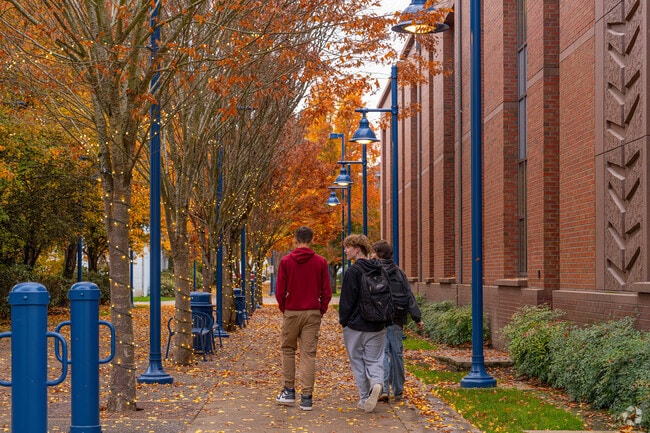 Students walk home from school on a fall evening in the family friendly city of Sherwood, OR.