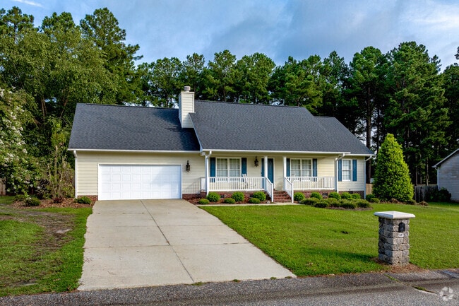 Ranch homes with porches and two car garages have well maintained lawns in Rockfish.