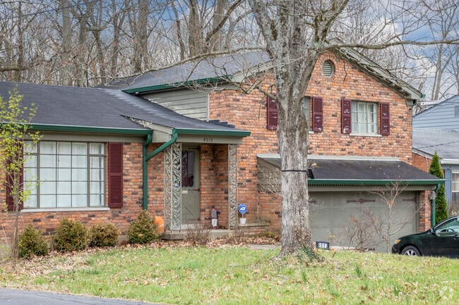 A brick split-level home with attached garage in Mount Washington.
