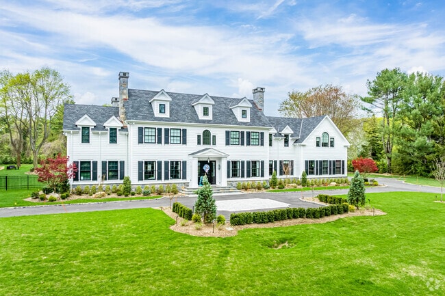 Beautiful white colonial mansions can be found in Muttontown.