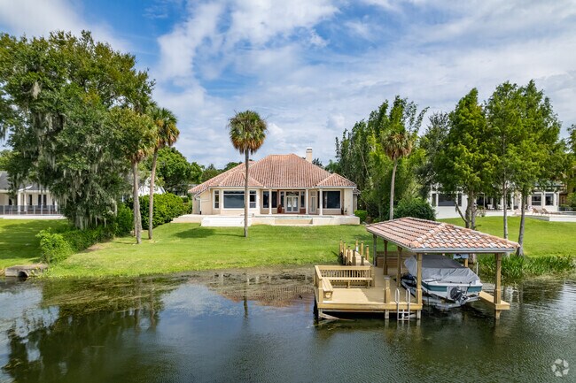 Experience the grandeur of Spanish influenced waterfront homes in Maitland.