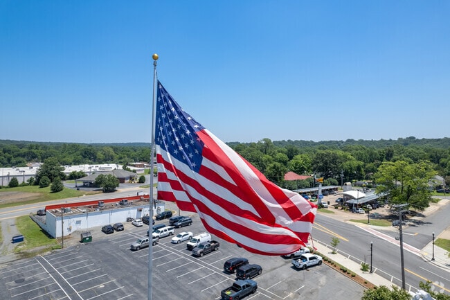 A large flag overlooks Camp Robinson Road in Levy.