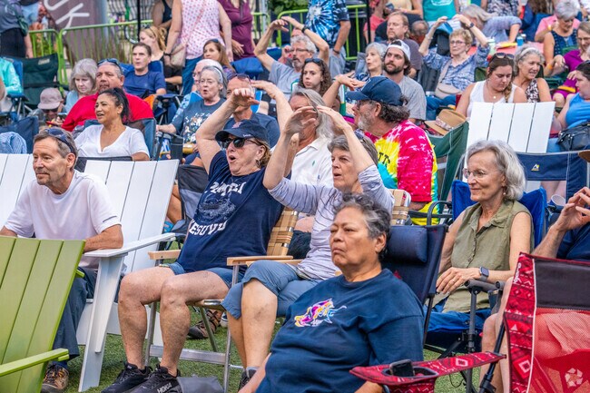 Locals enjoy moving to the music of Music on the Lawn.
