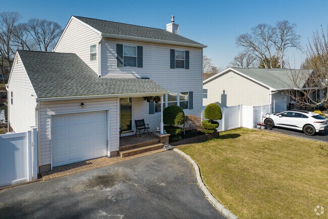 Colonial homes line suburban streets in Lake Ronkonkoma.