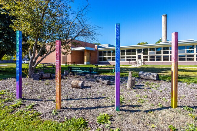 Moore Elementary art poles in courtyard