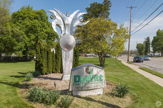 A DeWitt Charter Township sign stands on the corner of Sheridan and East St in Creston