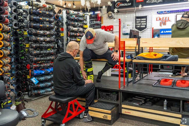 Residents come to the Opportunity neighborhood to get fitted for skis and snowboards.
