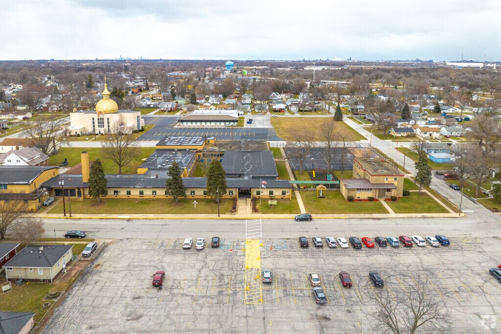Saint John Bosco School has a large parking lot for staff and guests.