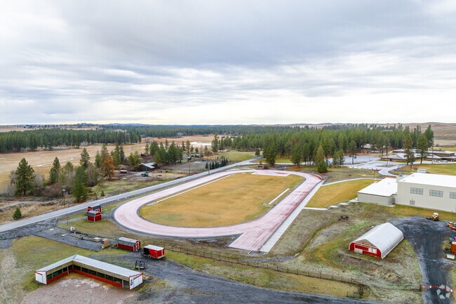 Liberty High School features a large football field with a track around it.