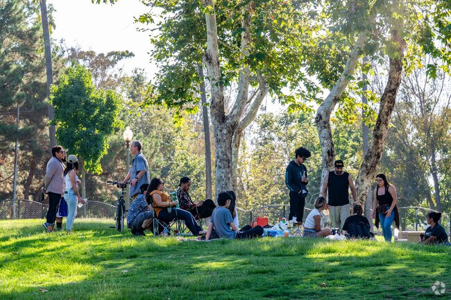 A group gathers at Cesar E Chavez Park in West Village-Long Beach.