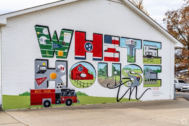 The White House mural spans the fire station wall near the town center.