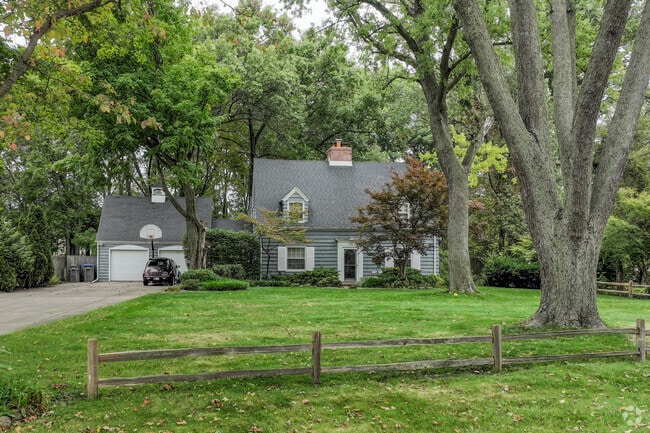 Cape Cod style homes with detached garages are common in McNaughton.
