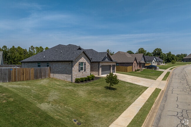 Newer subdivisions of traditional homes are sprouting up at the edges of Pea Ridge.