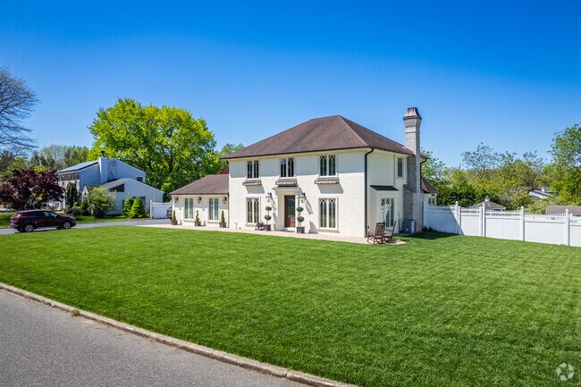 This brick Colonial Revival in Stony Brook is absolutely stunning.