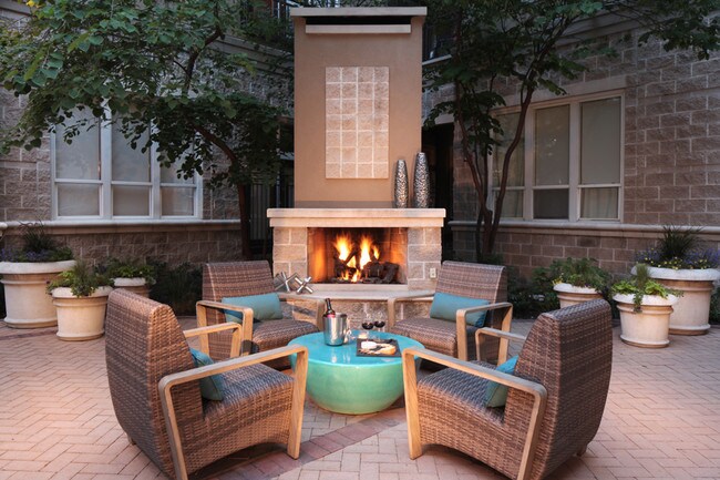 Pool deck equipped with fireplace and ample seating