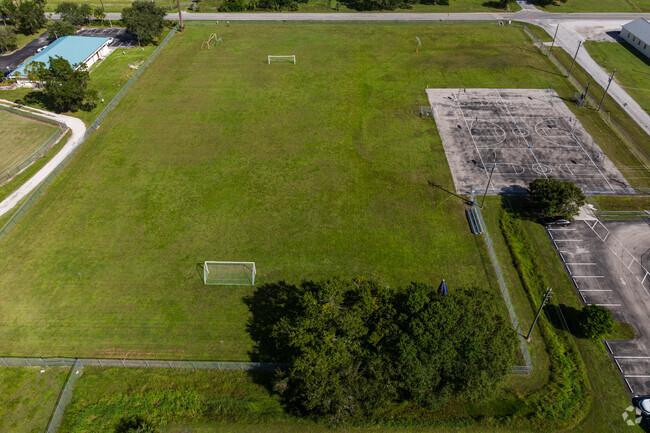 The Alva School has an athletic field and basketball courts.