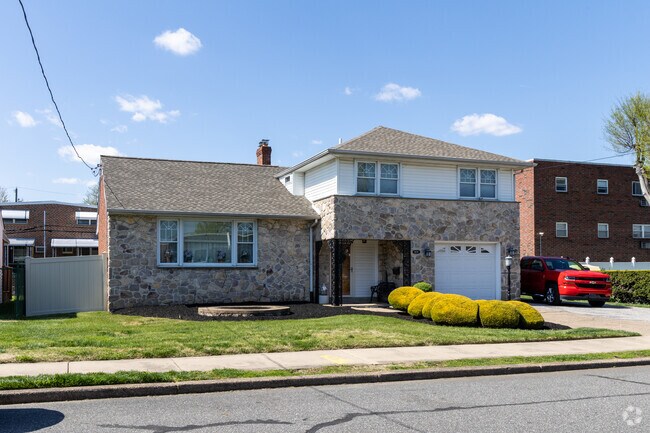This Split-Level in Torresdale has a nice size front lawn and back yard.