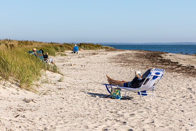 Relax on sandy shores under clear skies at West Island Town Beach.