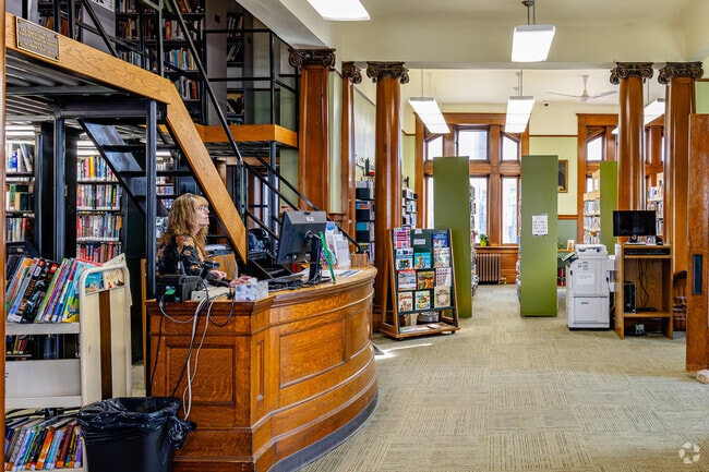 Hudson's historic Carnegie Library features an iconic mezzanine and Grecian pillars.